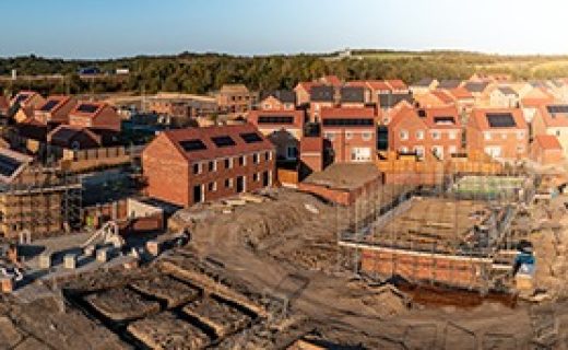 Aerial,Panoramic,Landscape,View,Of,A,New,Build,Housing,Estate Aerial panoramic landscape view of a new build housing estate with houses under construction to fill the gap in the UK home shortage and supplement the UK Government's Right To Buy policy